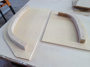 The stern and bow moulds for the stem laminations. MDF cut to shape and screwed to a board and then the workbench.